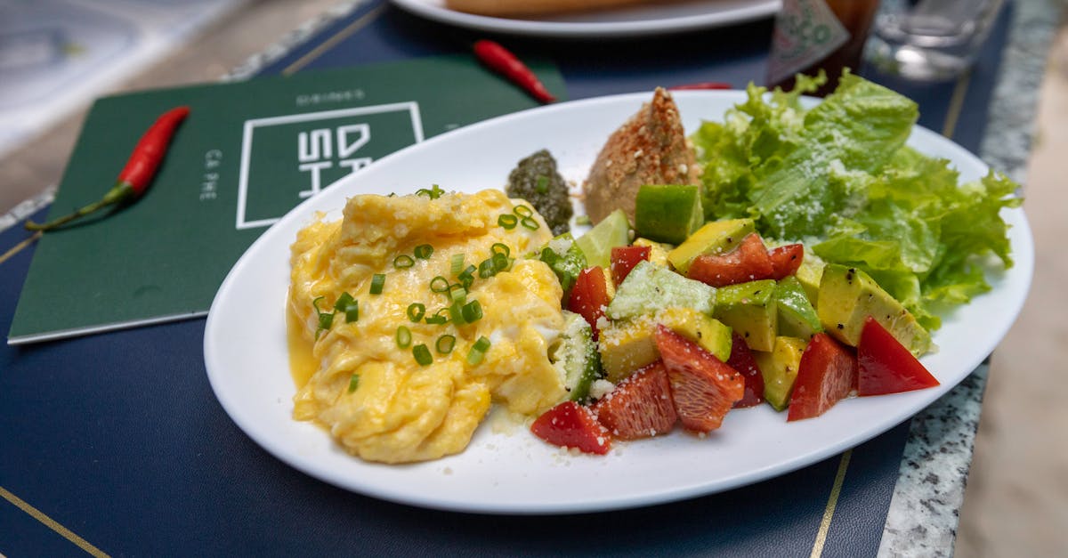 A smartphone showing CalEye's pricing screen beside a plate of healthy food
