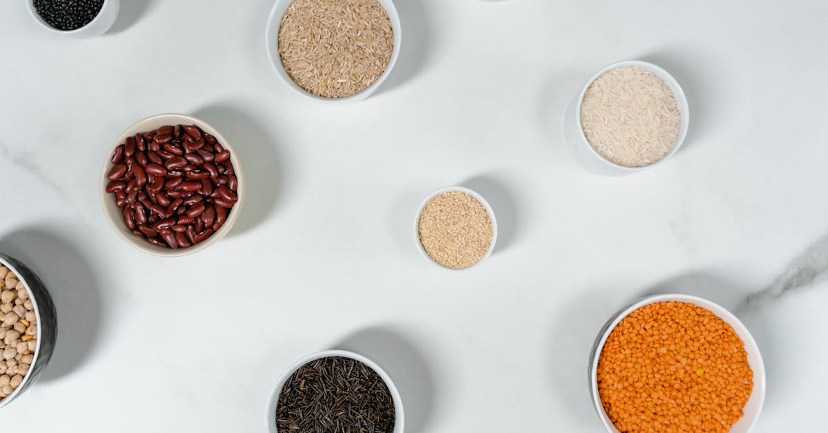 Three bowls in a row — white rice, brown rice, quinoa