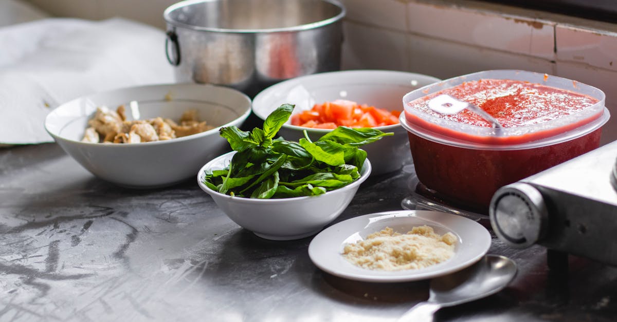 A spread of Indian buffet dishes in steel serving trays viewed from above