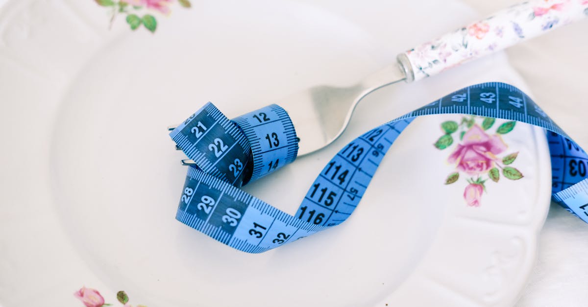 A new mother tracking her nutrition on a phone while caring for an infant