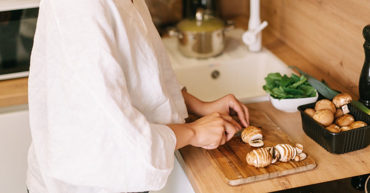 A meal prep container with portioned food beside a phone showing a quick-log screen