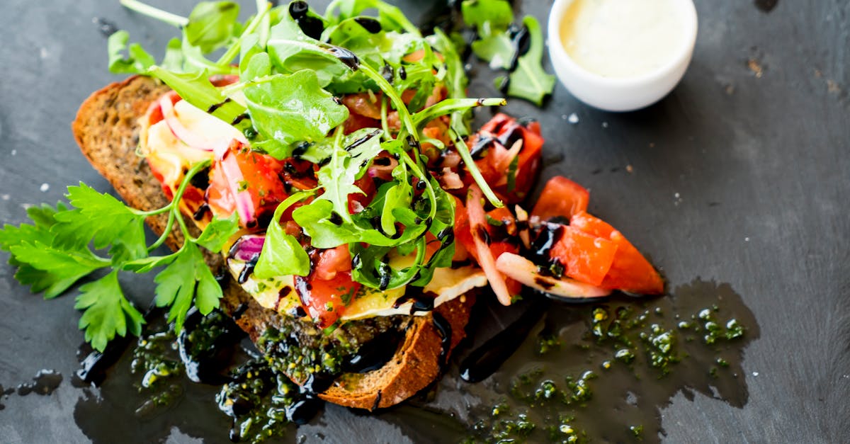 A traveller tracking meals on a phone at a restaurant table abroad